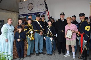 Regiment with civilians and Comptroller Topinka and Plaque